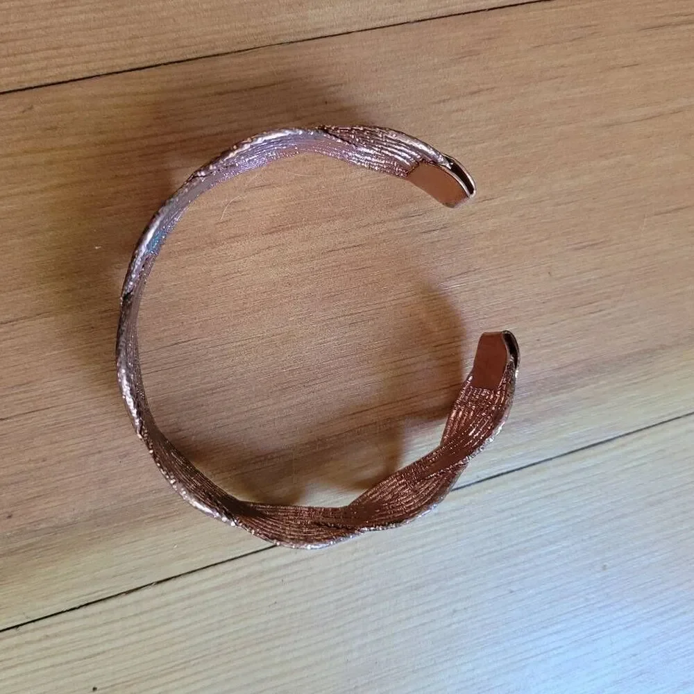 Set of two bracelets copper colored wavy bangle and stretchy beaded multicolored